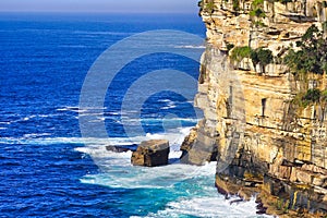 Pacific Ocean Waves Crashing at Bottom of Sandstone Cliffs, Sydney, Australia