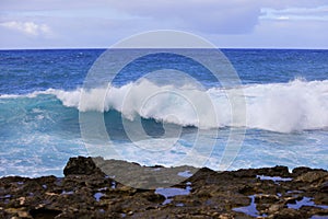 Pacific ocean waves crashing on rocks