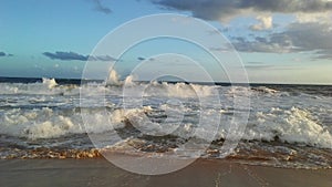 Pacific Ocean Waves during Sunset at Kekaha Beach Park in Kekaha on Kauai Island, Hawaii.