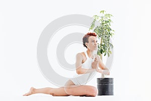 Pacified african american young woman sitting and practicing yoga