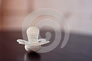 Pacifier on a black and white background. photo