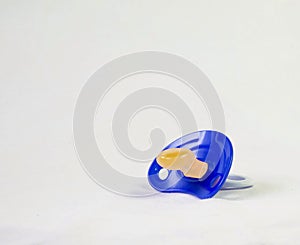 Pacifier blue for boy isolated in white for background