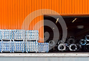 Pack of aluminum ingot bar stack on warehouse dock for container stuffing. Distribution warehouse and industrial raw material logi