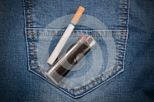 Pack of cigarettes and lighter in pocket jeans