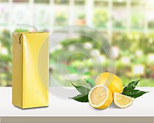 Pack of delicious lemon juice on table