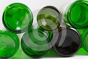 Pack of empty beer and wine green and brown glass bottom bottles, on a white background. Reuse, Eco-Friendly