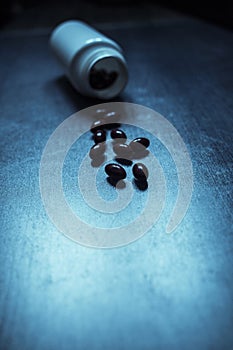 pack of pills on a blue retro table