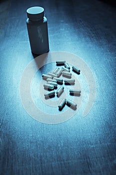 pack of pills on a blue retro table