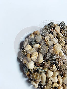 a pack of river stones to decorate ornamental plants, aquariums, pots on a white background