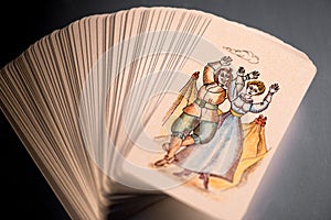 Pack of tarot cards with a Happiness card on top