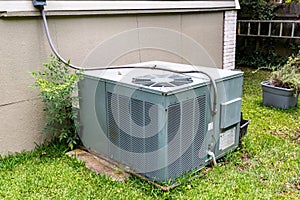 Package Air Conditioner system next to a home