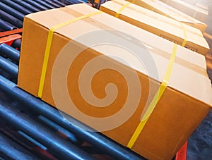 Package Boxes Moving on Conveyor Belt. Cartons, Parcels Boxes. Warehouse Shipping. Supplies Cargo Shipment.