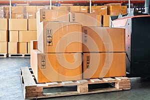 Package Boxes Stack on Wooden Pallets. Cardboard Boxes, Parcels, Warehouse Shipping, Supply Chain, Cargo Supplies