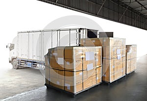 Package Boxes Wrapped Plastic Film on Pallets Loading with Shipping Cargo Container. Supply Chain. Truck Loading at Dock Warehouse