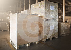Package Boxes Wrapped Plastic Flim on Pallets at Storage Warehouse. Shipping Warehouse Logistics