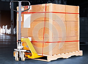 Package Boxes Wrapped Plastic on Pallet and Hand Pallet Truck. Supply Chain Supplies Shipment Goods. Distribution Shipping