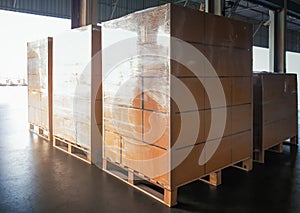 Package Boxes Wrapped Plastic on Pallets in Warehouse. Warehouse Shipping, Supplies Distribution, Shipment Supply Chain Logistics