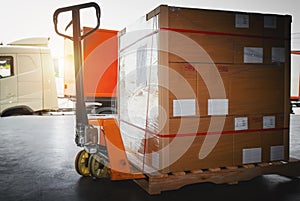 Package Boxes Wrapped Plastic Stacked on Pallets. Hand Pallet Truck. Forklift Loader. Warehouse Logistics Cargo Transport