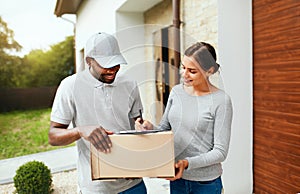 Package Delivery. Man Courier Delivering Box To Woman At Home