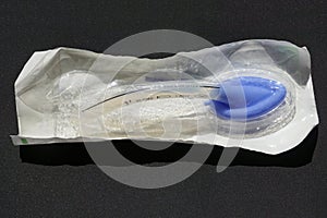 Packaged Laryngeal mask airway for emergency medical help on a black background