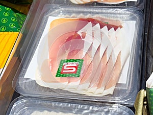 Packaged sliced ham in clear plastic tray on display