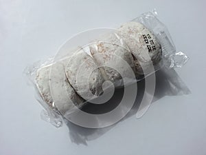 Packaged white donut on white background