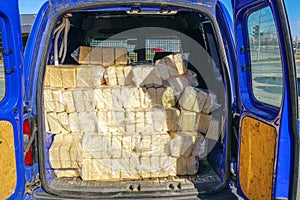 Packaged wood sawdust briquettes loaded in a car, biofuel with good heat output