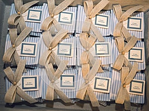 Packages for favors with blue and white stripes for baptism