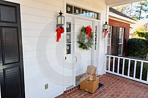 Packages on front porch of home during holiday season