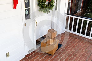 Packages on front porch of home during holiday season