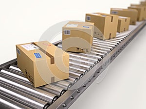 Packages and parcels delivery concept - cardboard boxes on conveyor
