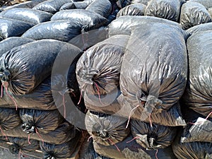 Packages with rubble and sand on construction site. Building materials base