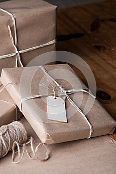 Brown paper packages wrapped up with string