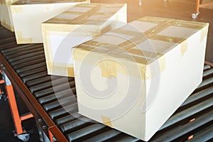 Packaging Boxes Moving on Conveyor Belt. Cartons, Cardboard Boxes. Storehouse. Distribution Warehouse. Shipping Supplies Warehouse