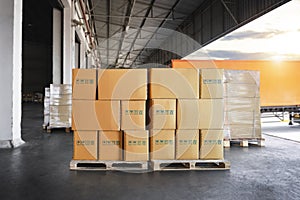 Packaging Boxes Stacked on Pallets Loading into Cargo Container. Cartons Cardboard Boxes. Distribution Supplies Warehouse Logistic