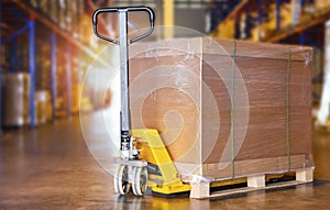 Packaging Boxes Wrapped Plastic on Pallet with Hand Pallet Truck. Distribution Storage Warehouse. Cargo Shipment. Supplies