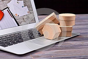 Packaging paper and shipping boxes on laptop.