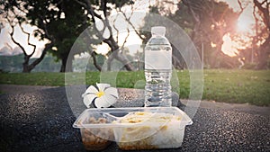 Packed box for breakfast or lunch meal. Easy rice box with  water ready for eat in park