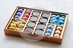 Packed chocolates on a white wooden background. gift chocolate