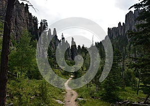 Packed Dirt Pathway with Large Towering Stones