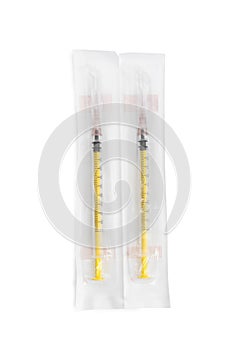 Packed disposable syringes with needles on white background, top view