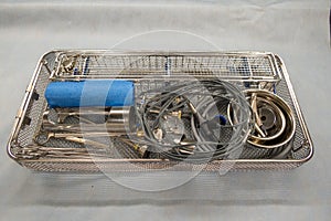 A packed instrument tray for performing a urological resection is open in the operating room photo
