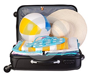 Packed suitcase full of vacation items