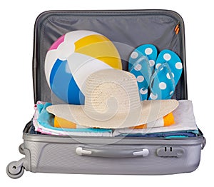 Packed suitcase full of vacation items