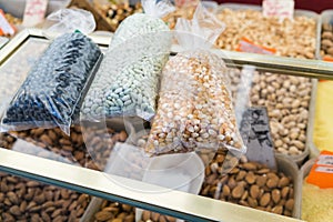 Packets of dried beans on counter in Paris market