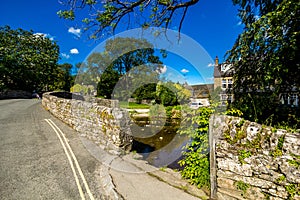 Packhorse bridge over the Malham Beck, Malham, Yorkshire Dales, North Yorkshire, England, UK