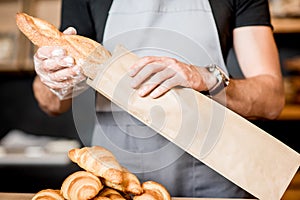 Packing bread into the paper bag