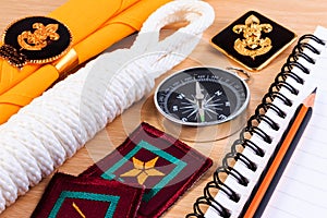 Packing checklists for scout camping trips, trip vacation, mock up close-up on wooden table.