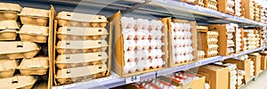 Packing with chicken eggs on the store shelf.