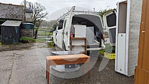 Packing a home removals van truck full of furniture photo